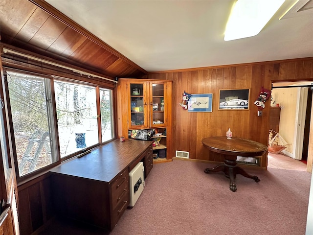 office featuring light colored carpet, vaulted ceiling, wooden walls, wood ceiling, and ornamental molding