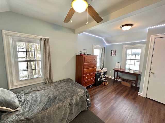 bedroom with ceiling fan, lofted ceiling with beams, and dark hardwood / wood-style floors