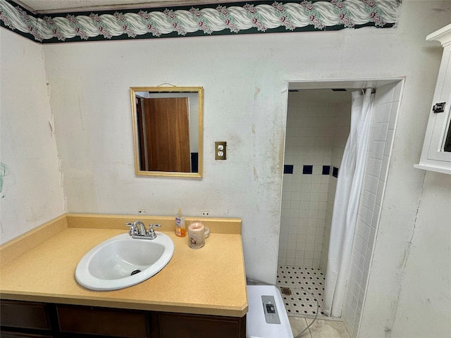 bathroom with tile patterned floors, curtained shower, and vanity