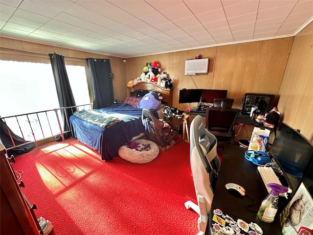 bedroom featuring wood walls