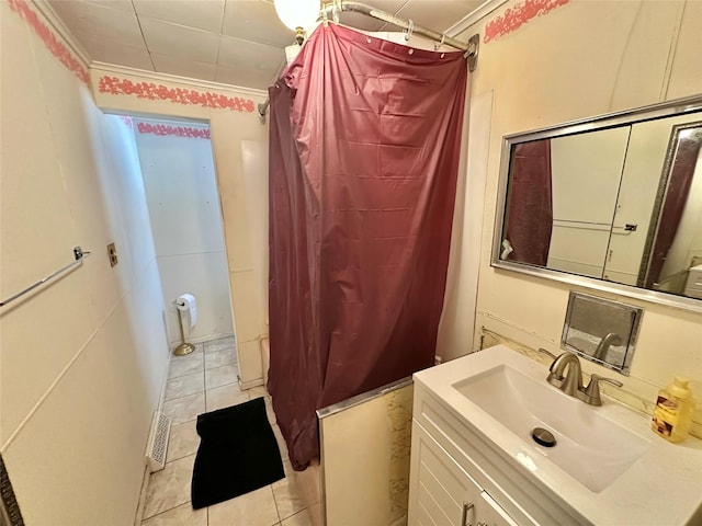 bathroom with tile patterned floors, vanity, shower / bath combo, and ornamental molding