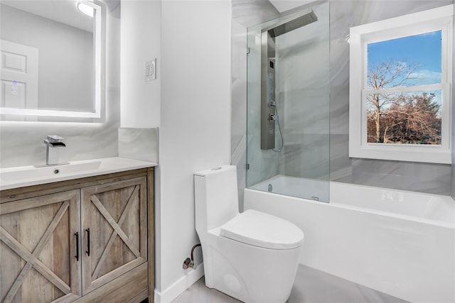 full bathroom featuring vanity, enclosed tub / shower combo, and toilet