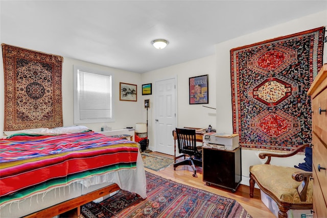 bedroom with light wood-type flooring