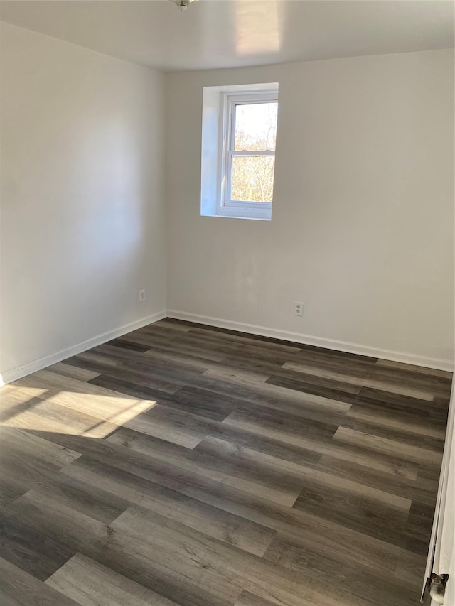 unfurnished room featuring dark hardwood / wood-style floors