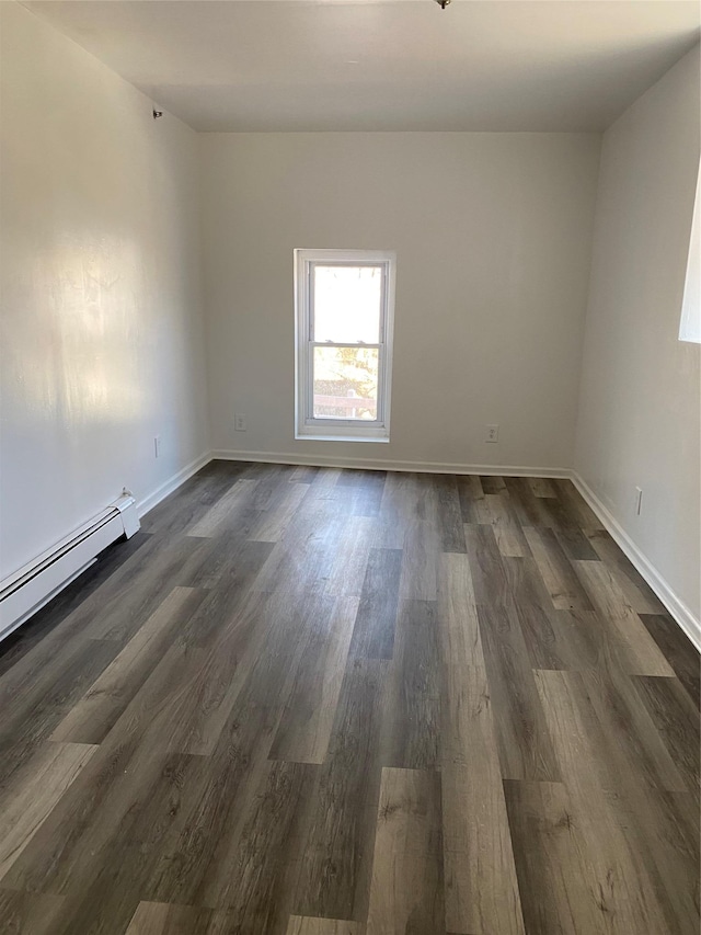 spare room featuring dark hardwood / wood-style floors