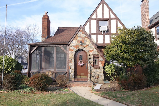 english style home with a sunroom