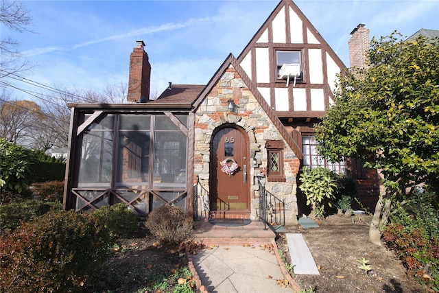 tudor home with a sunroom