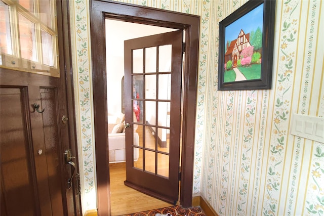 entryway with hardwood / wood-style flooring