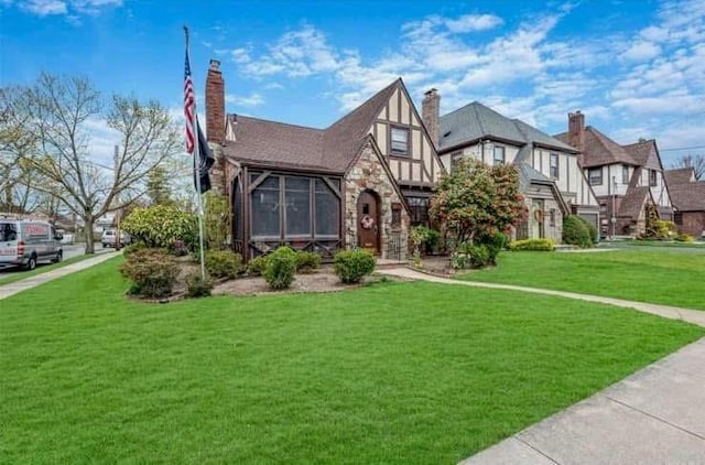 tudor house with a front lawn