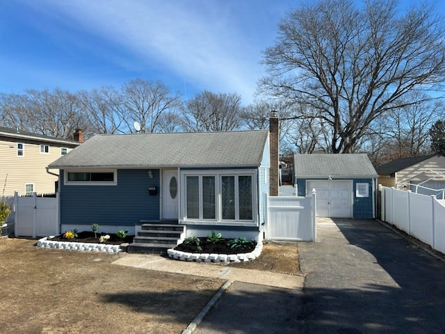 view of front of home with an outbuilding and a garage