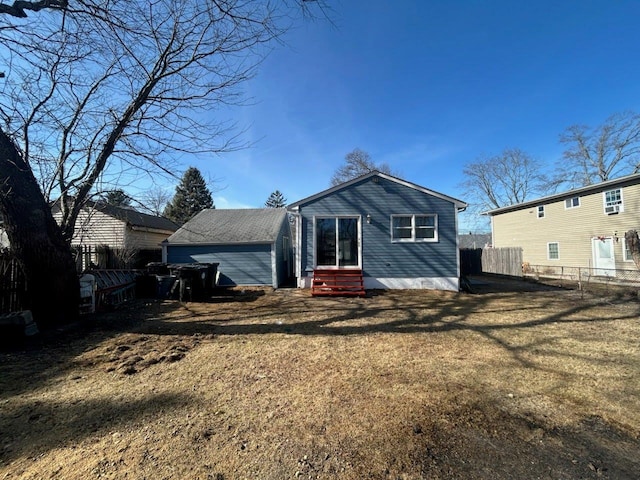 back of house featuring a lawn