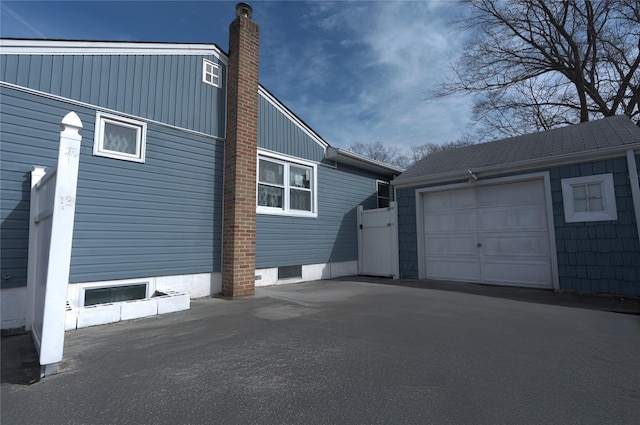 view of property exterior featuring a garage