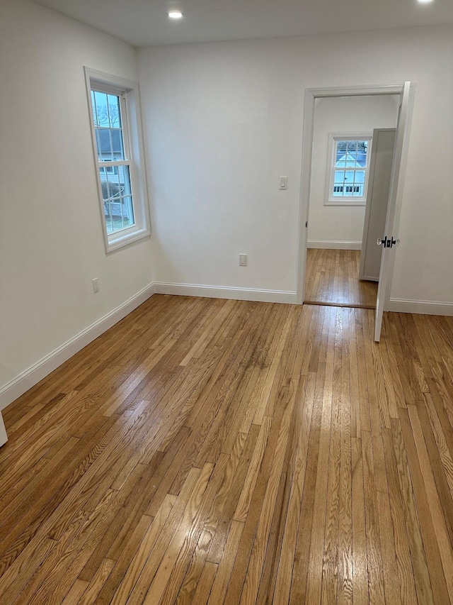 spare room featuring light hardwood / wood-style flooring