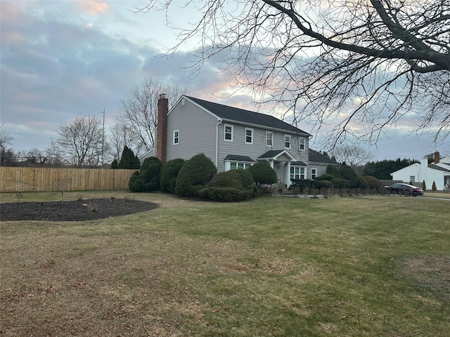 view of home's exterior with a lawn