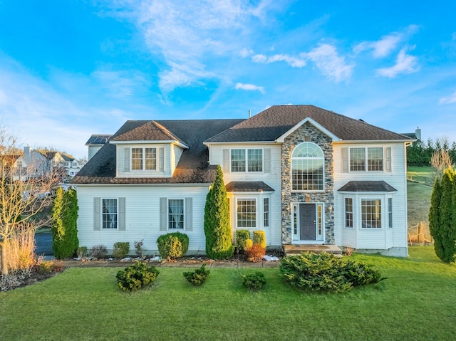 view of front of home with a front lawn