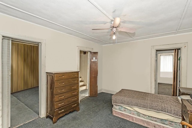 carpeted bedroom featuring ceiling fan