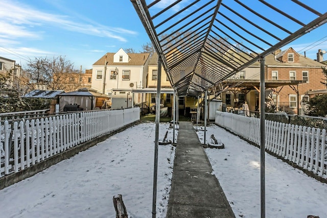 snow covered property featuring a gazebo