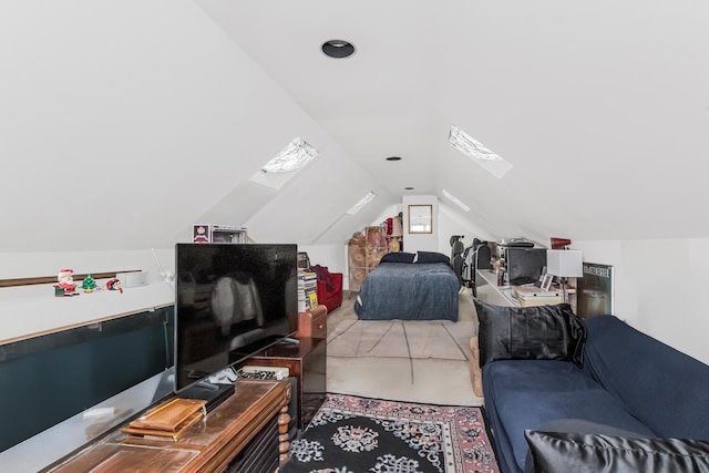 bedroom with vaulted ceiling with skylight