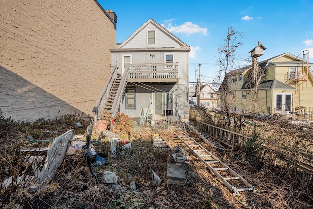 rear view of property with a balcony