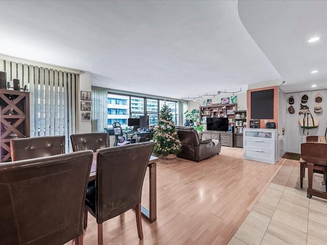 dining space with light hardwood / wood-style floors