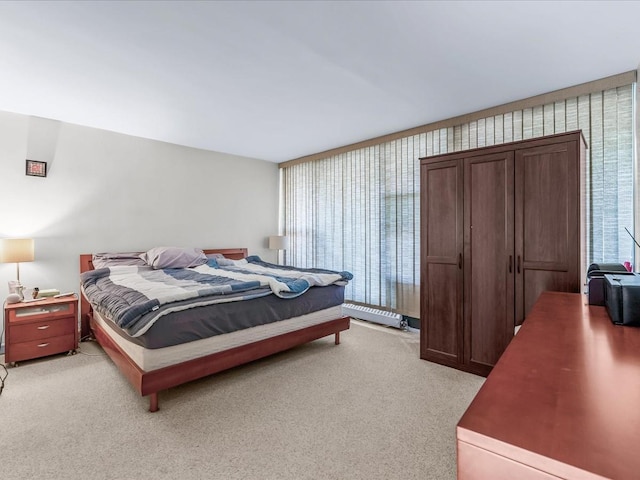 bedroom with light colored carpet