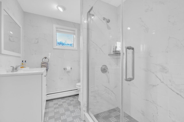 bathroom with vanity, a baseboard radiator, a shower with shower door, and toilet