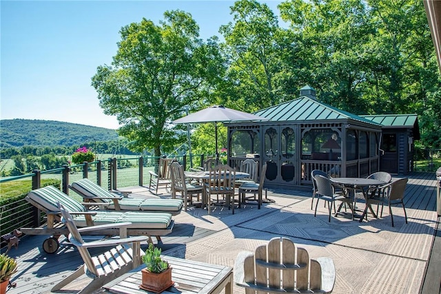 view of patio / terrace with a gazebo and a wooden deck