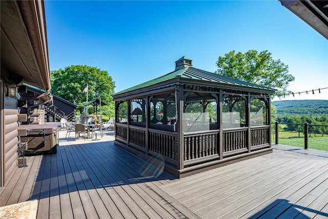 wooden terrace featuring a sunroom