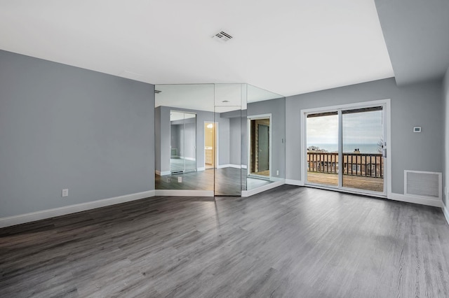 interior space with access to outside and hardwood / wood-style flooring