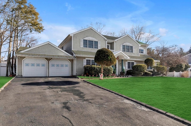 view of front property with a garage and a front lawn