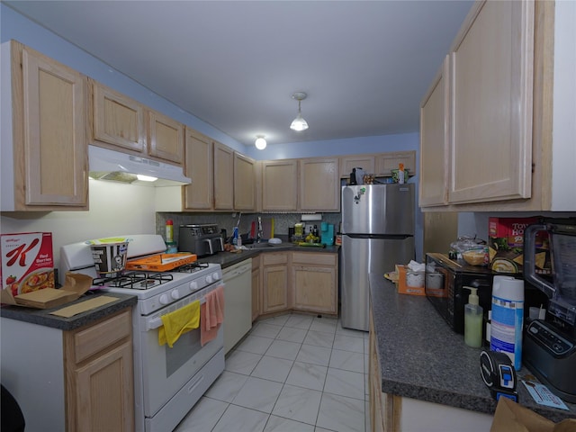 kitchen featuring tasteful backsplash, light brown cabinetry, white appliances, and sink