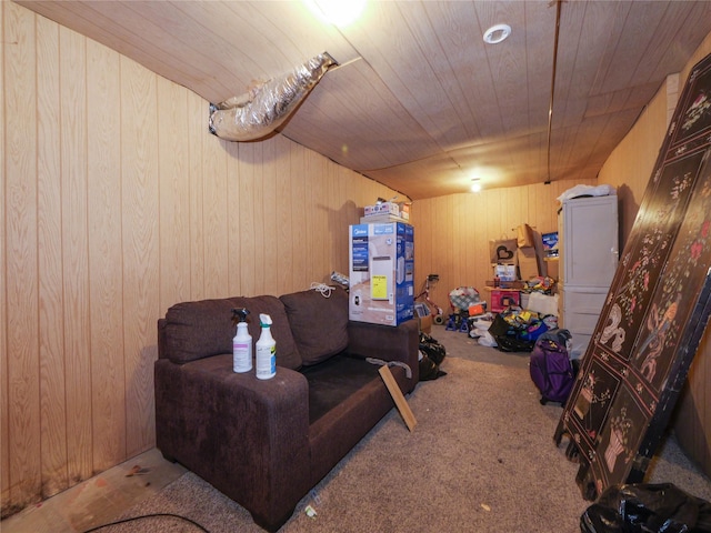 interior space featuring wood ceiling, carpet floors, and wooden walls