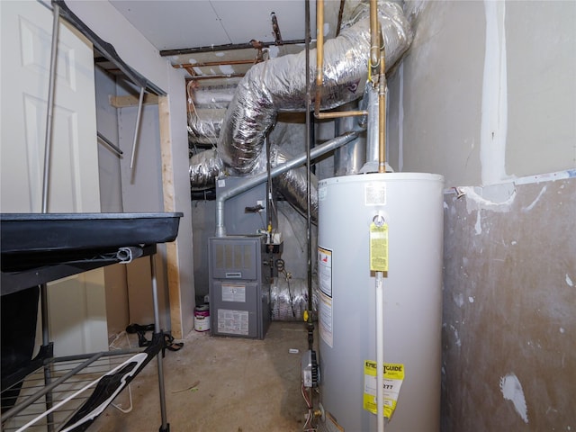 utility room featuring water heater