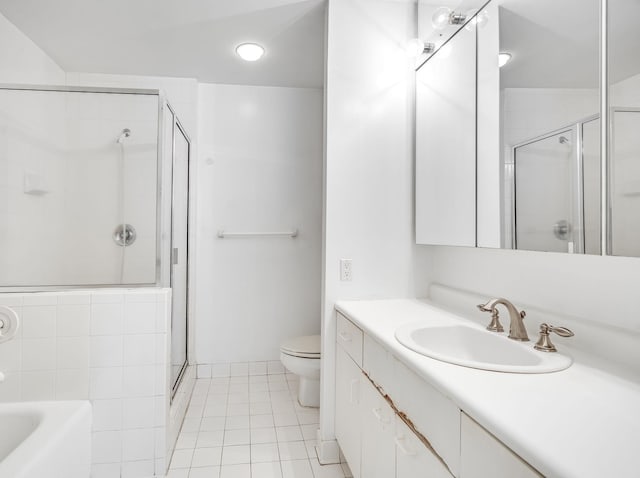 bathroom featuring a shower with door, tile patterned floors, toilet, and vanity