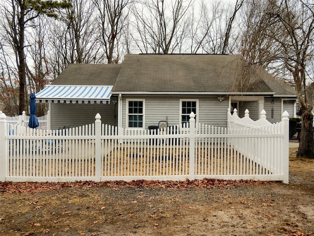 single story home with a fenced front yard