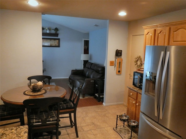 dining area with recessed lighting, vaulted ceiling, and baseboards