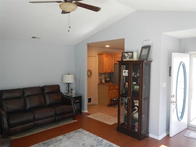 11 Westchester Ct, Middle Island, NY 11953 - living room with vaulted ceiling, ceiling fan, wood finished floors, and visible vents