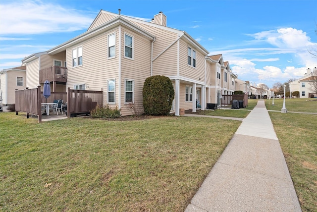 view of home's exterior featuring a lawn