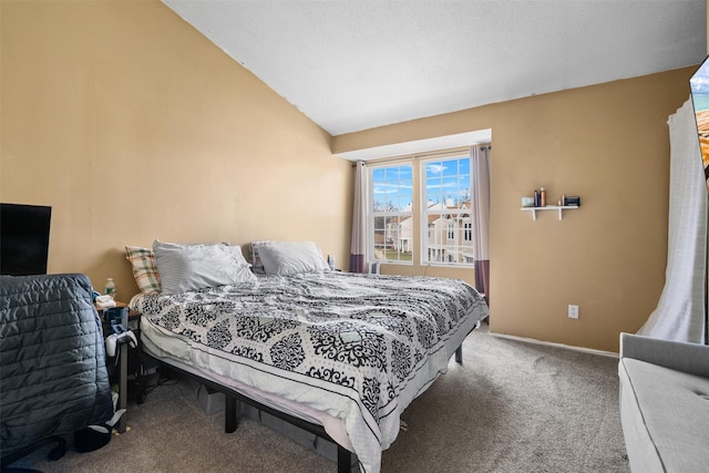 bedroom featuring carpet flooring and vaulted ceiling