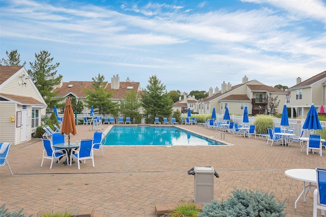 view of swimming pool with a patio