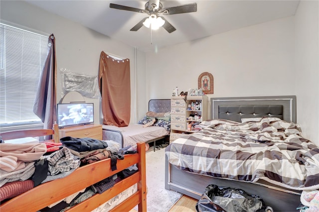 bedroom with hardwood / wood-style floors and ceiling fan