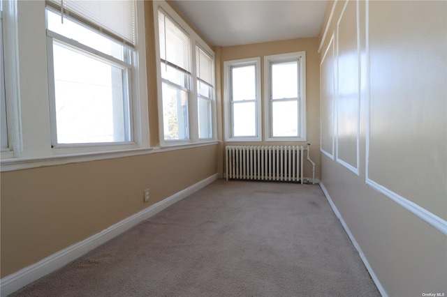 unfurnished sunroom with radiator