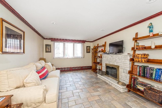 living room with crown molding and a fireplace