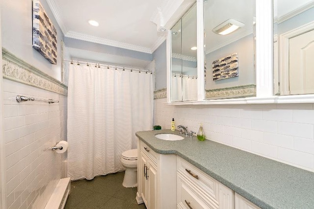 bathroom with crown molding, vanity, and toilet