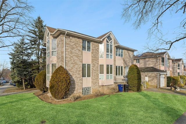 view of home's exterior featuring a yard