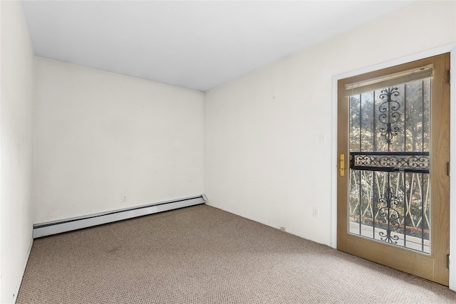 empty room with carpet floors and a baseboard heating unit