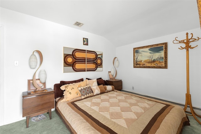 carpeted bedroom featuring lofted ceiling and visible vents