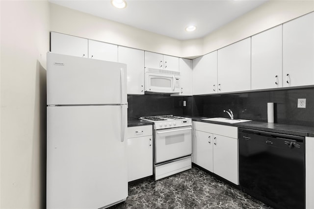 kitchen featuring white appliances, a sink, white cabinetry, decorative backsplash, and dark countertops