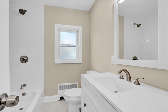 full bathroom featuring vanity, toilet, radiator heating unit, and tiled shower / bath