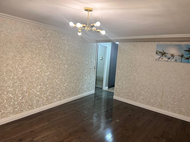 unfurnished room with ornamental molding, dark wood-type flooring, and a notable chandelier